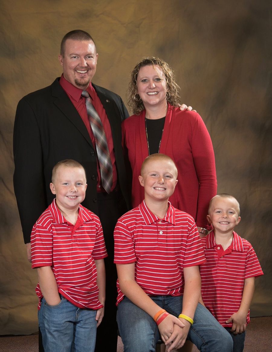 The McGeorge family standing together, studio portrait
