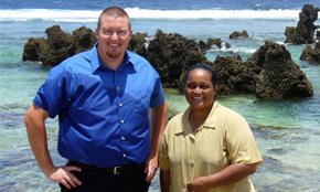 Adam McGeorge with a church member on the shore in Nauru